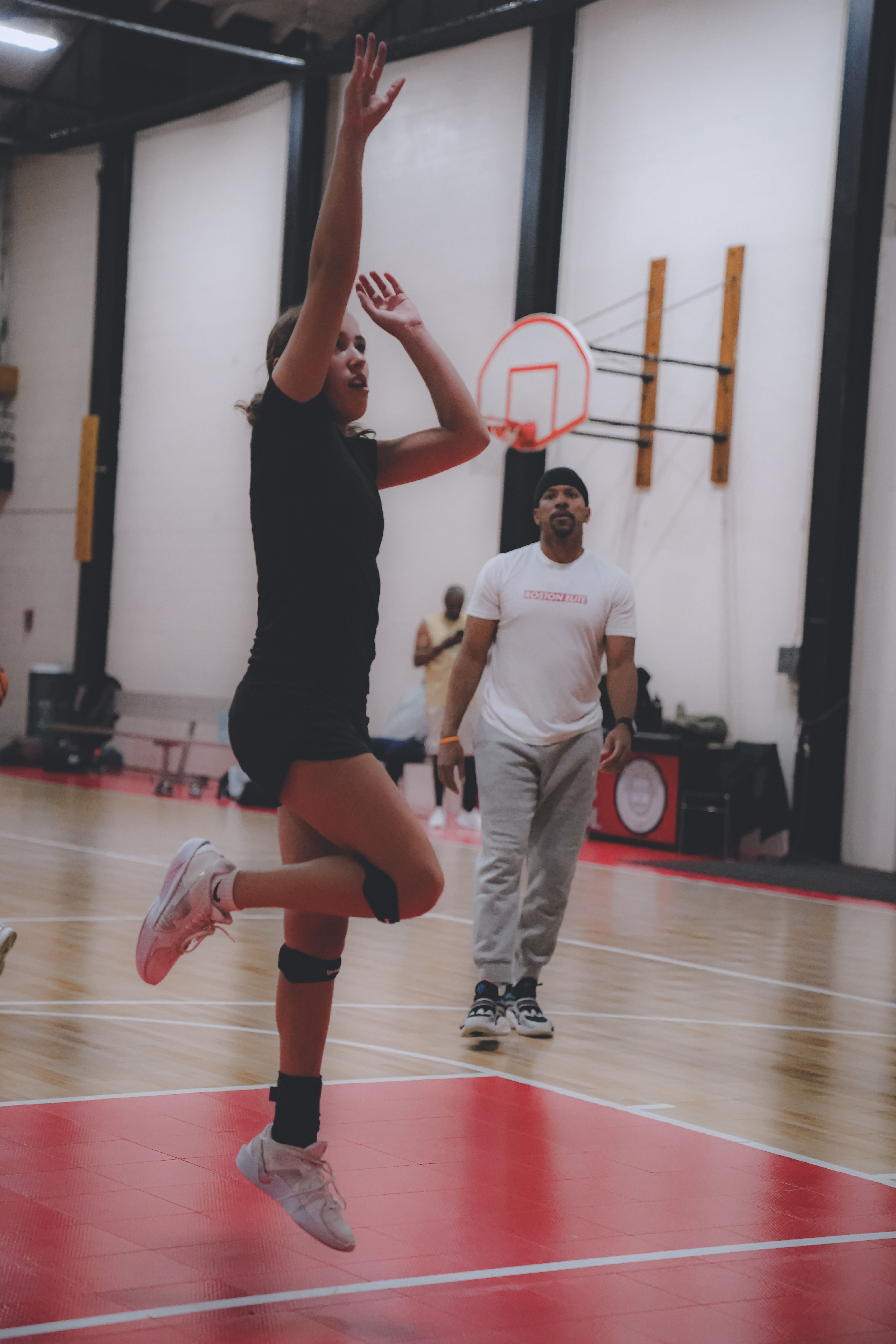Youth athletes practicing basketball drills